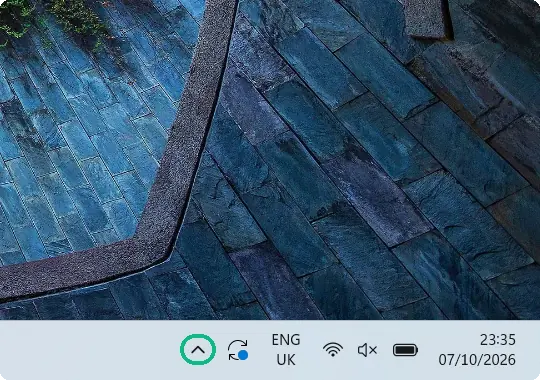 Taskbar with the hidden icons arrow (^) highlighted